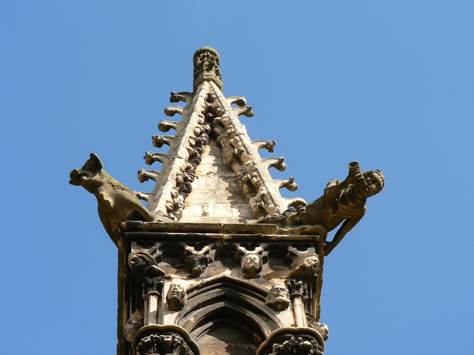 A Stone Pig and Man with Bugle Watch from High Atop Pinnacle on SE Side